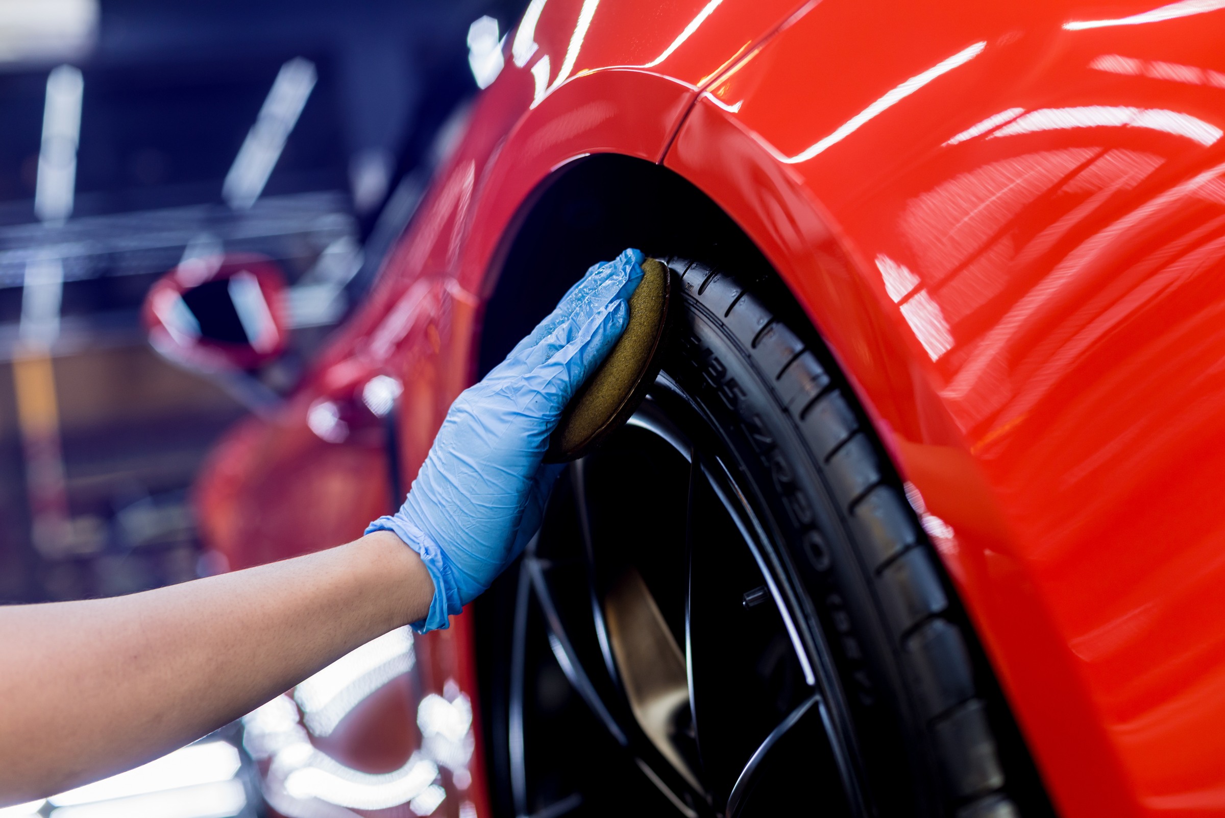 Polishing wheels with microfiber cloth during mobile paint correction service